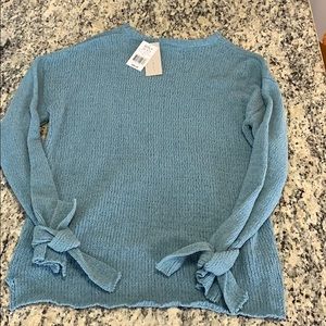 Scoop next. Super soft. Ties on the wrist.